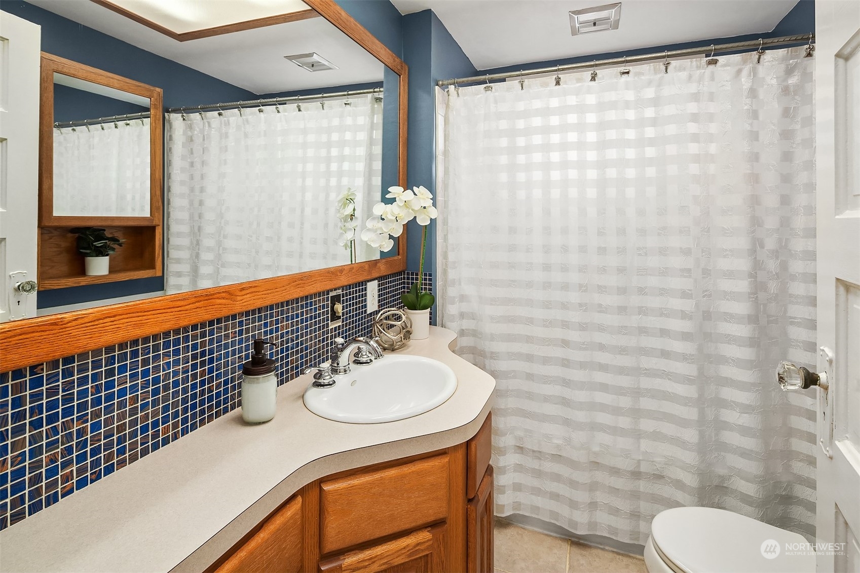 705 3rd Street Sultan, WA 98294 - Photo 15 of 26 a bathroom with a sink and a mirror