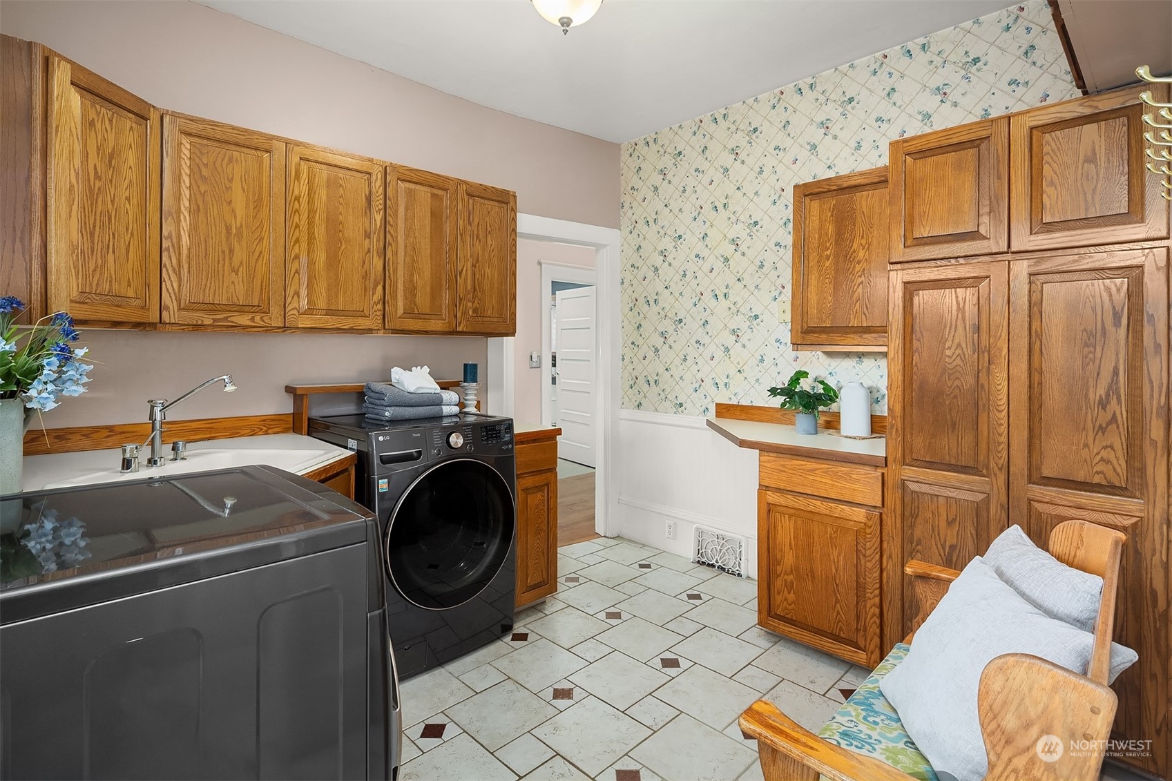 705 3rd Street Sultan, WA 98294 - Photo 16 of 26 a kitchen with stainless steel appliances granite countertop a sink a stove and a refrigerator