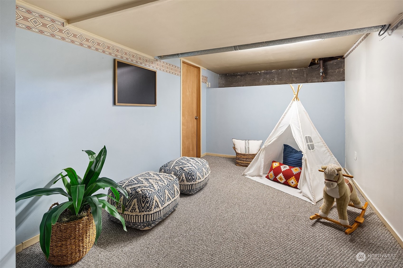 705 3rd Street Sultan, WA 98294 - Photo 18 of 26 a bedroom with furniture and a potted plant