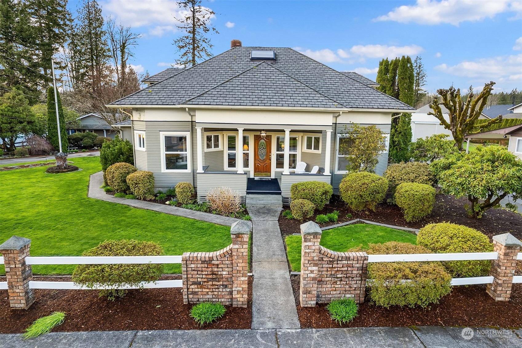 705 3rd Street Sultan, WA 98294 - Photo 19 of 26 a front view of a house with a yard table and chairs