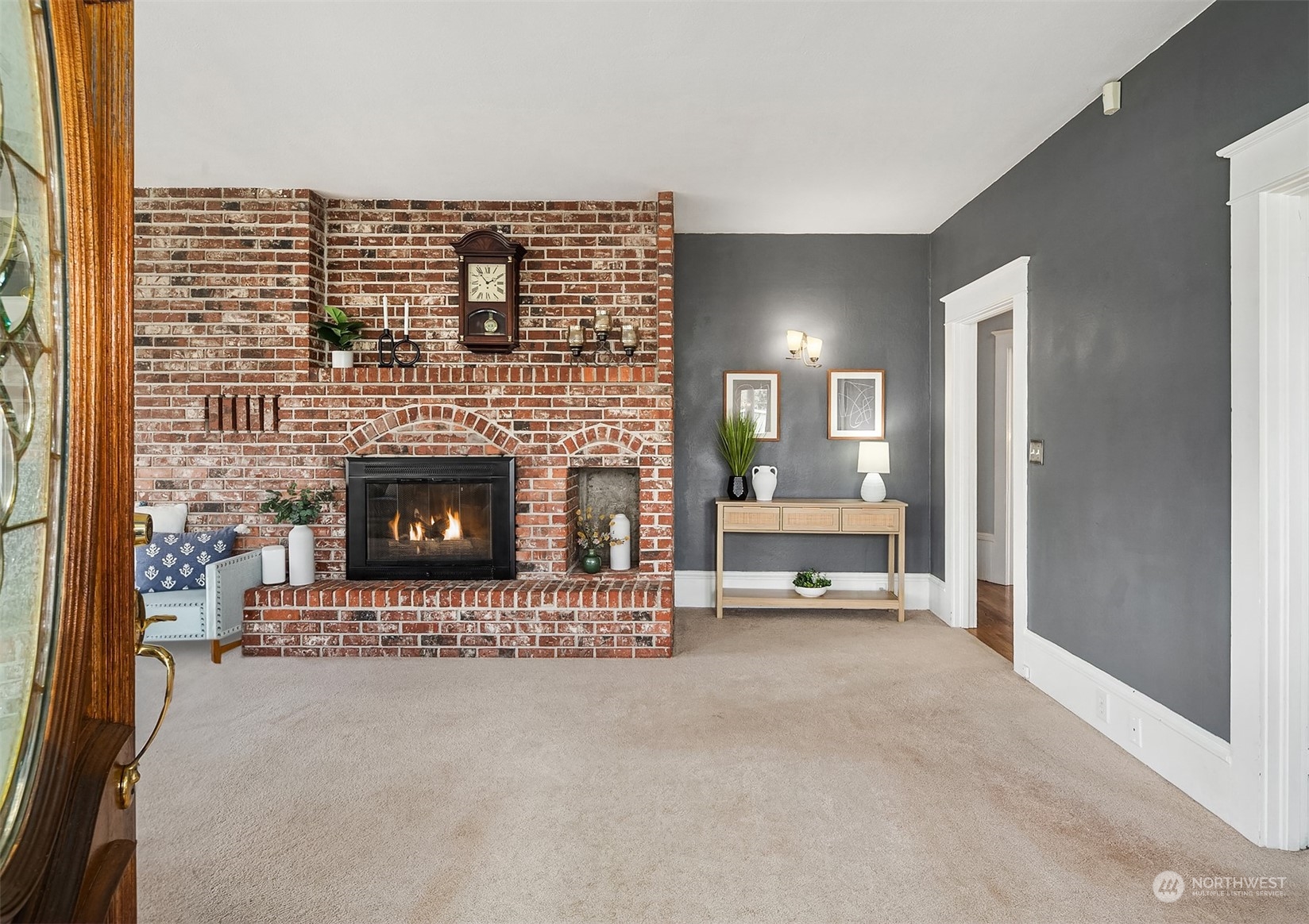705 3rd Street Sultan, WA 98294 - Photo 2 of 26 a living room with furniture and a fireplace
