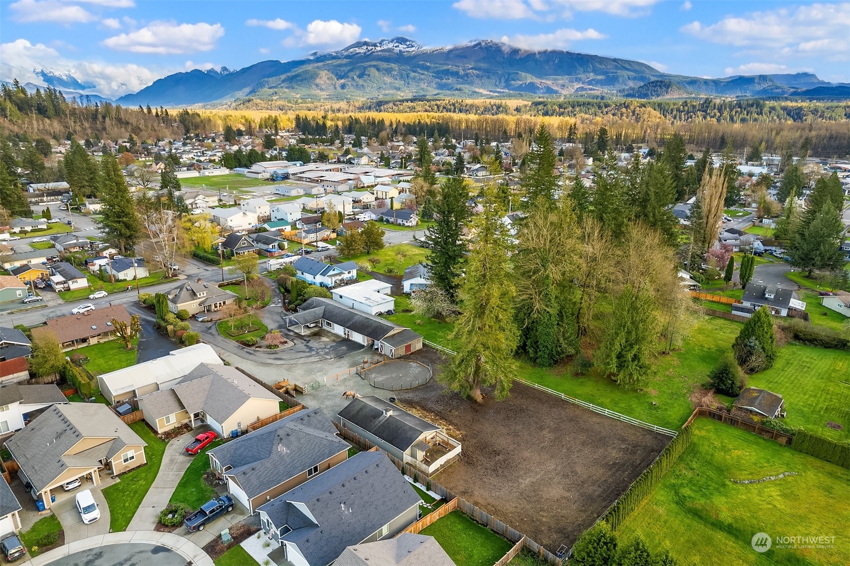 705 3rd Street Sultan, WA 98294 - Photo 23 of 26 a view of a city with mountains in the background