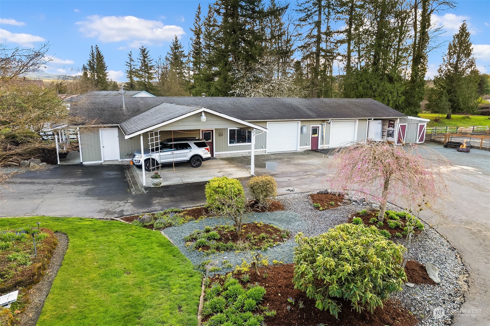 705 3rd Street Sultan, WA 98294 - Photo 24 of 26 a front view of a house with garden