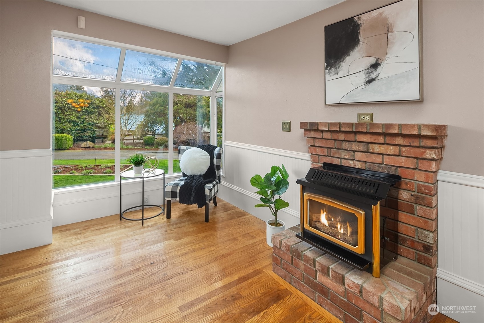 705 3rd Street Sultan, WA 98294 - Photo 7 of 26 a living room with furniture a large window and a fireplace