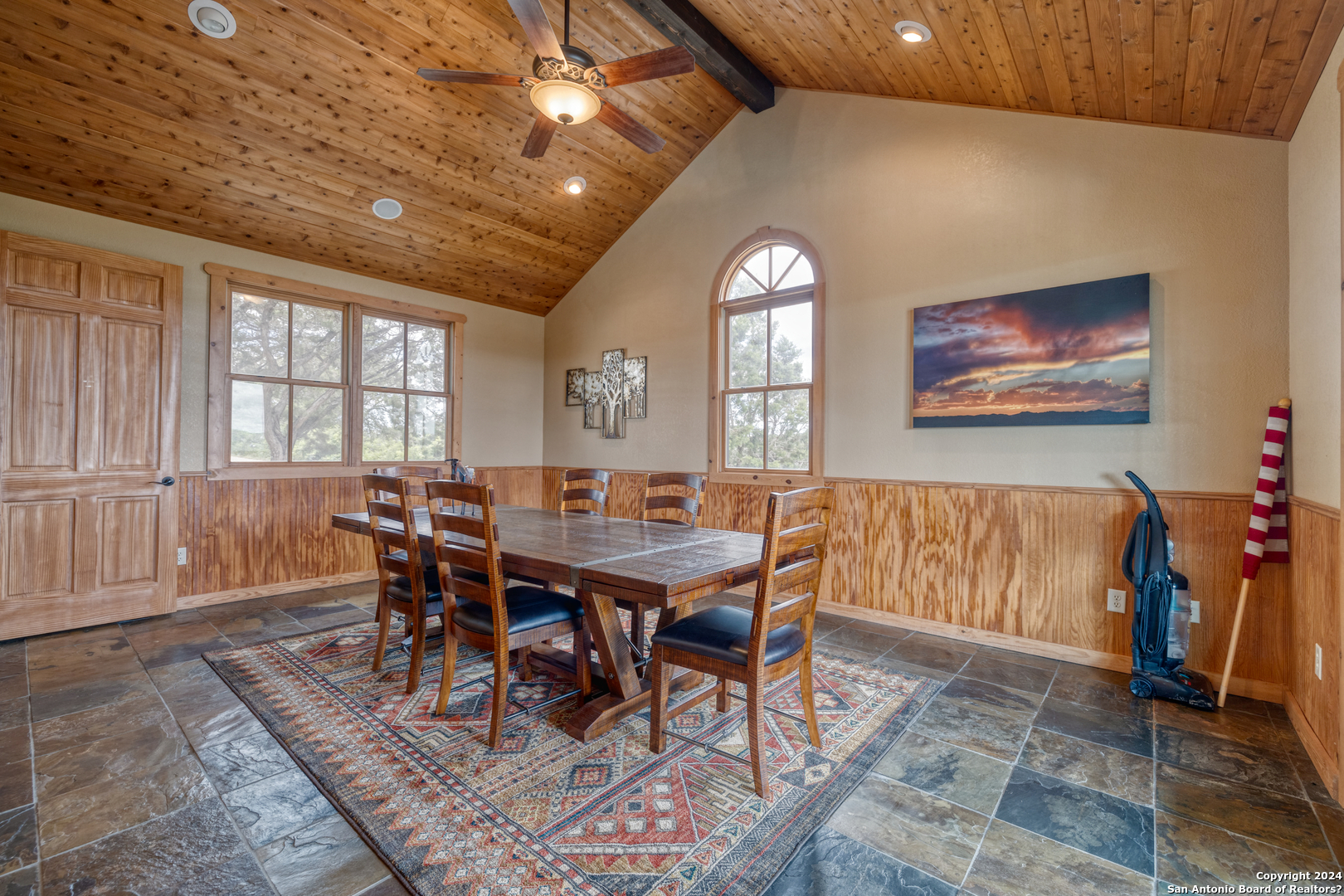 558 South Ridge Drive Concan, TX 78838 - Photo 12 of 35 a view of a dining room with furniture window and wooden floor