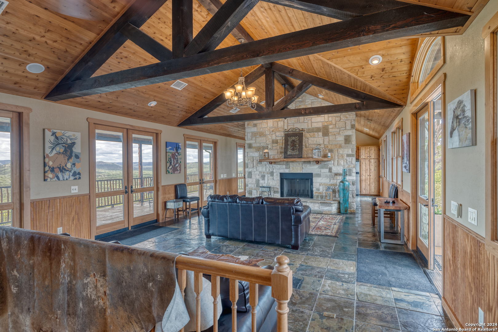558 South Ridge Drive Concan, TX 78838 - Photo 14 of 35 a living room with furniture wooden floor and a fireplace