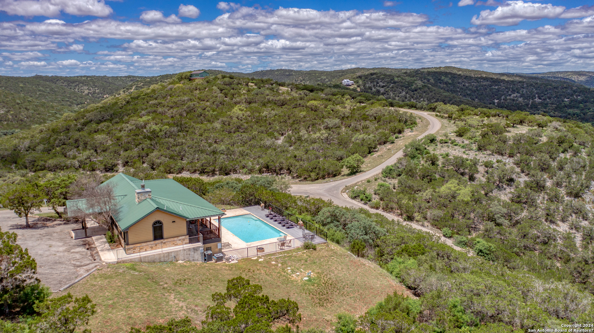 558 South Ridge Drive Concan, TX 78838 - Photo 3 of 35 a view of houses with a yard