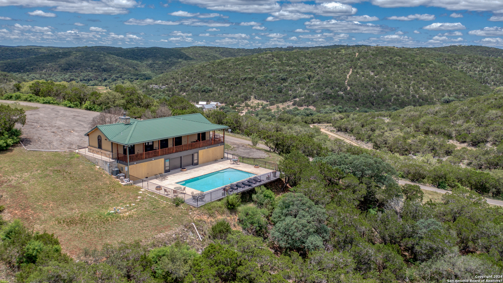 558 South Ridge Drive Concan, TX 78838 - Photo 7 of 35 an aerial view of a house with a yard