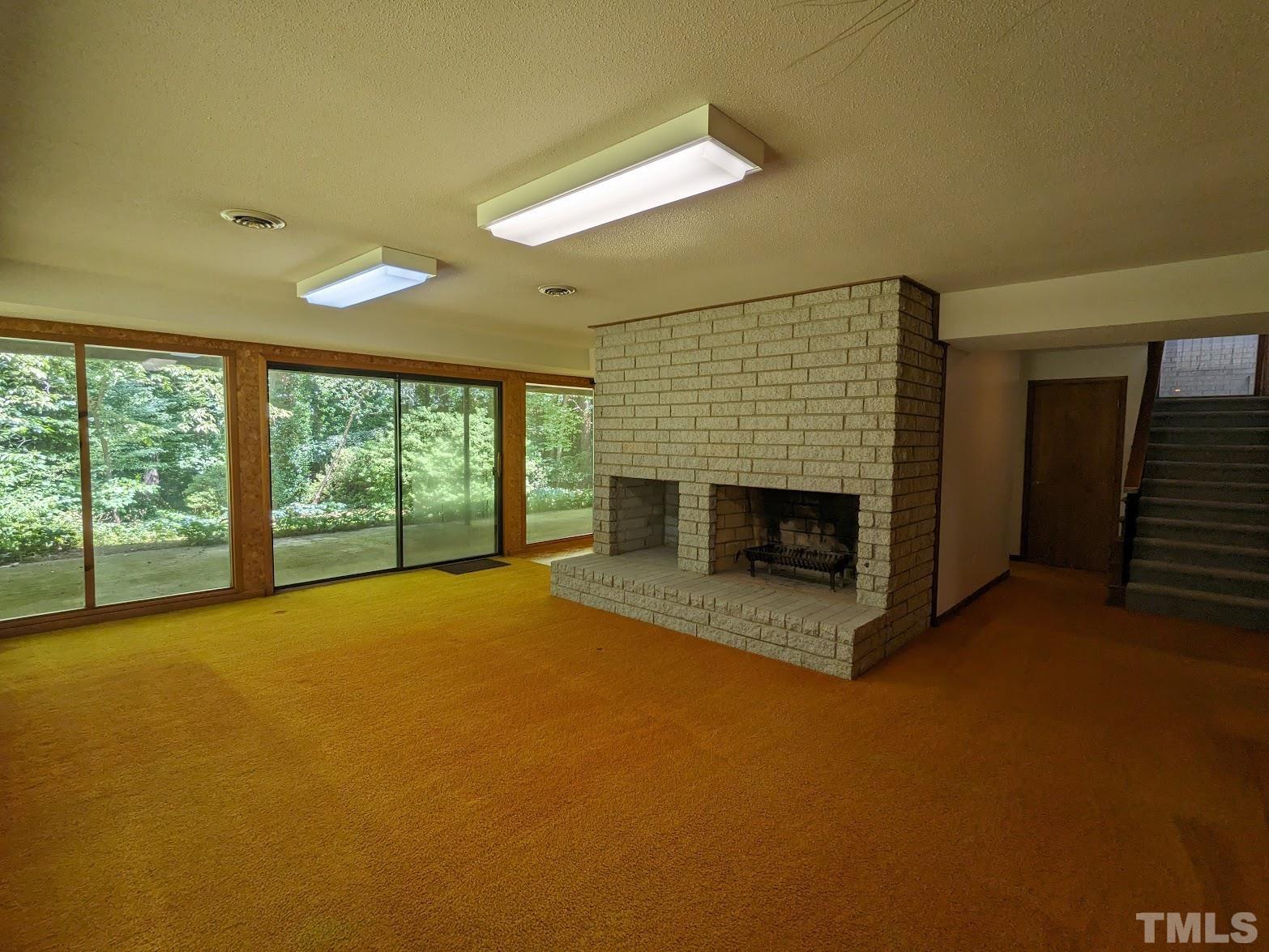 1107 Imperial Road Cary, NC 27511 - Photo 54 of 77 a view of empty room with fireplace and window