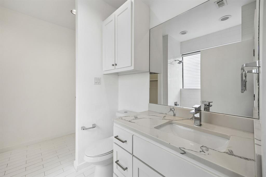1851 Summit Avenue, Unit 4 Dallas, TX 75206 - Photo 19 of 29 a bathroom with a sink and a toilet