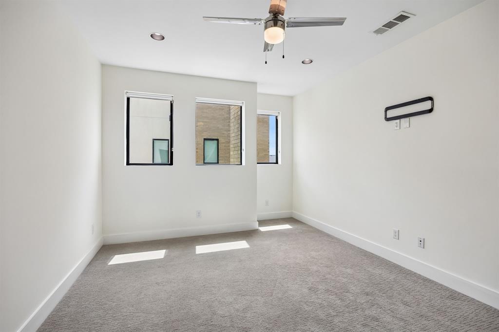 1851 Summit Avenue, Unit 4 Dallas, TX 75206 - Photo 22 of 29 an empty room with windows and fan