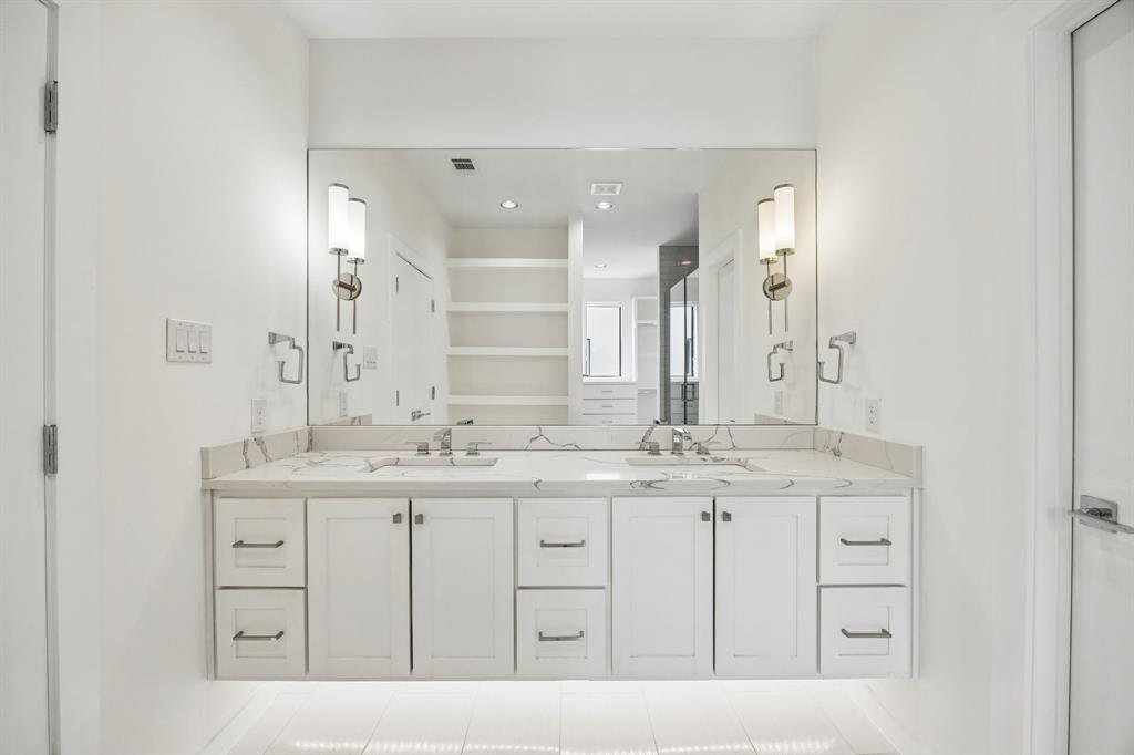 1851 Summit Avenue, Unit 4 Dallas, TX 75206 - Photo 24 of 29 a bathroom with a double vanity sink and mirror