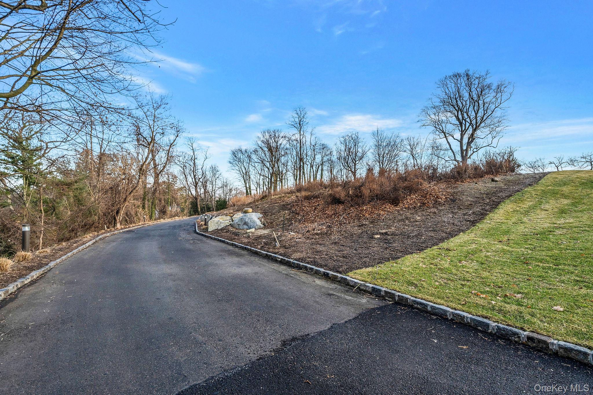 36 Cow Neck Road Sands Point, NY 11050 - Photo 18 of 18 a view of a backyard of the house