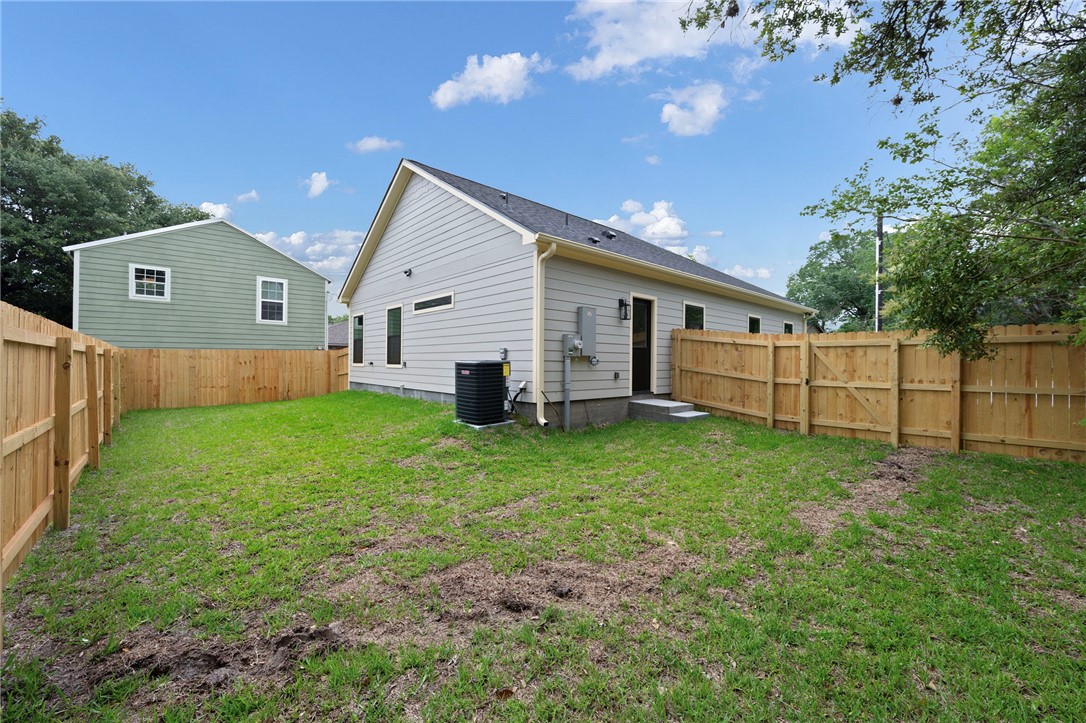 804 East 27th Street Bryan, TX 77803 - Photo 21 of 21 a view of a backyard with plants and large tree