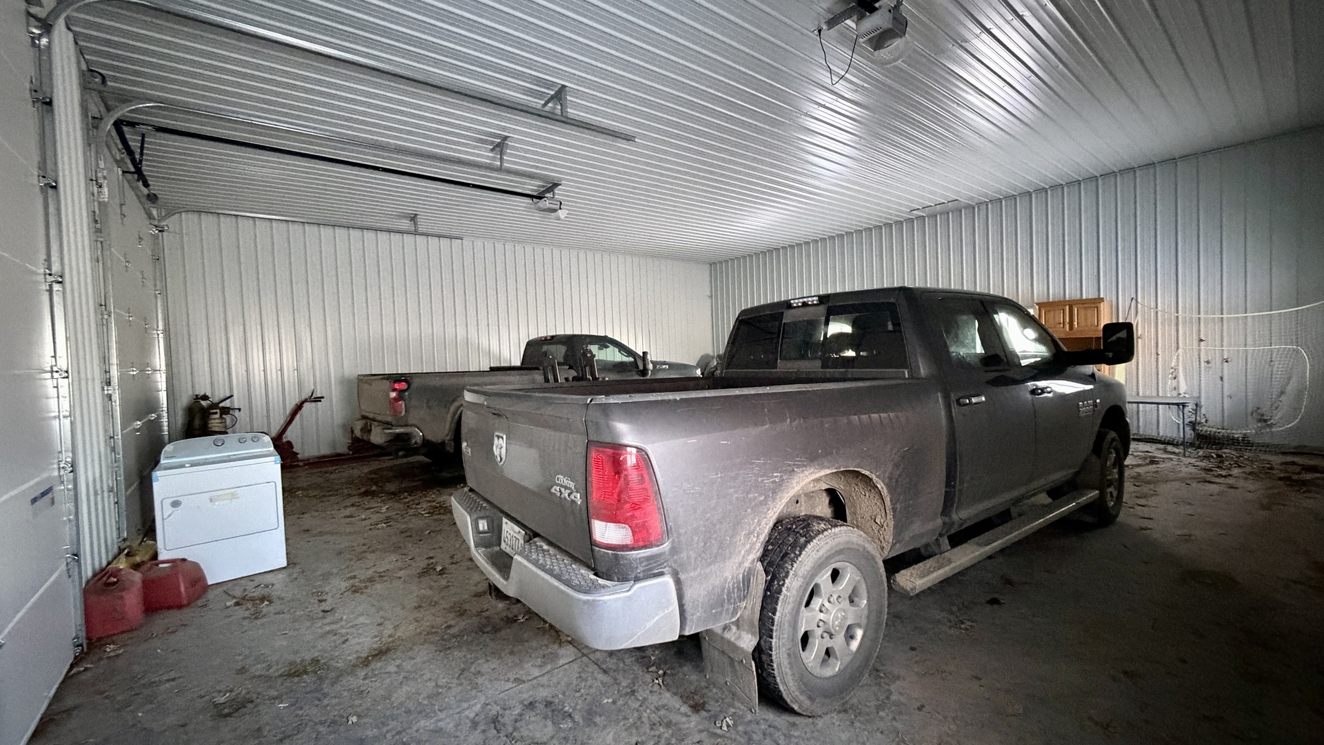 9120 Spring Valley Road Fulton, IL 61252 - Photo 18 of 59 a car is parked in a garage