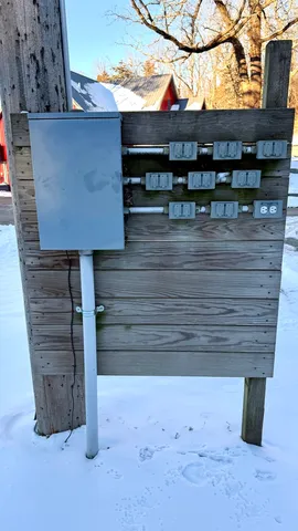 a view of a dining room with furniture a chandelier and wooden floor