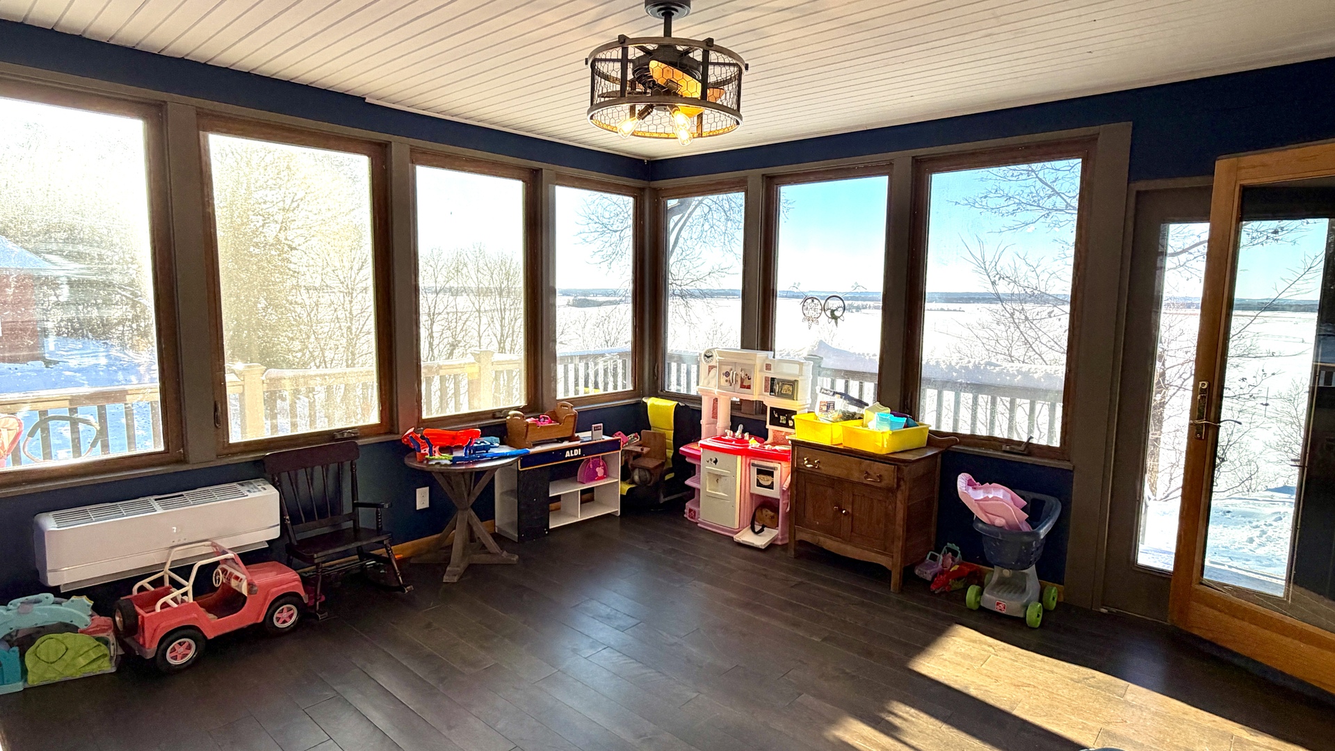 9120 Spring Valley Road Fulton, IL 61252 - Photo 29 of 59 a living room filled with furniture and floor to ceiling windows