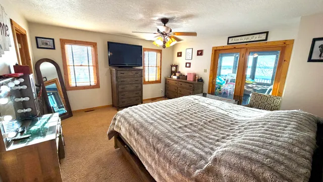 a bedroom with bed and a window