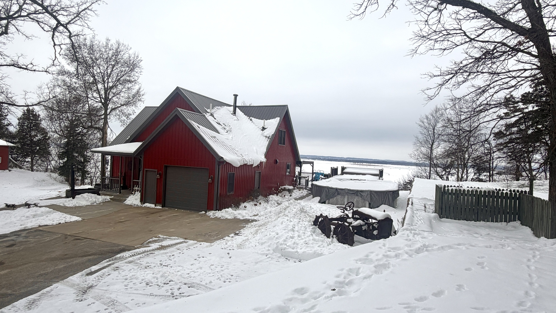 9120 Spring Valley Road Fulton, IL 61252 - Photo 4 of 59 a view of a house with a yard covered in snow