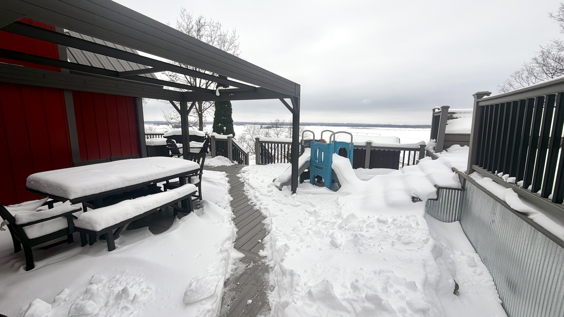 9120 Spring Valley Road Fulton, IL 61252 - Photo 7 of 59 a view of a patio with a table chairs and a barbeque