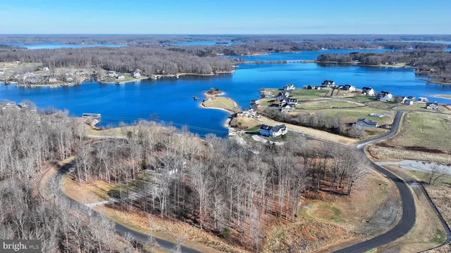 an aerial view of a houses with ocean view