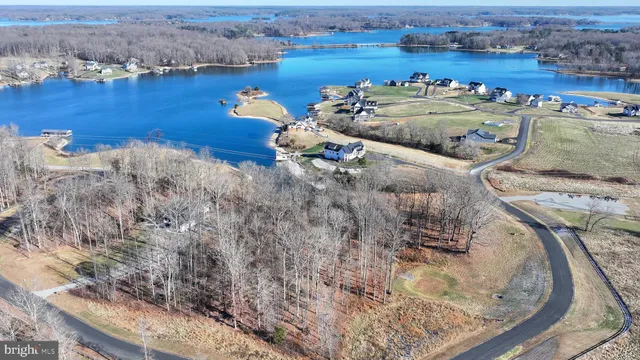 an aerial view of a house with a ocean view