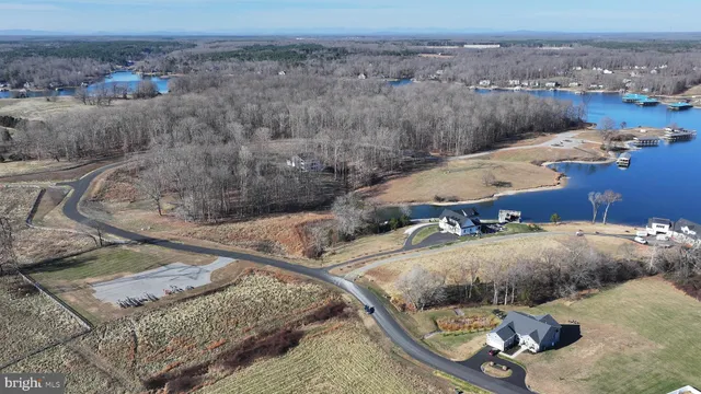 an aerial view of a house with outdoor space