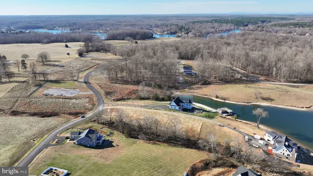 a view of a backyard with table and chairs