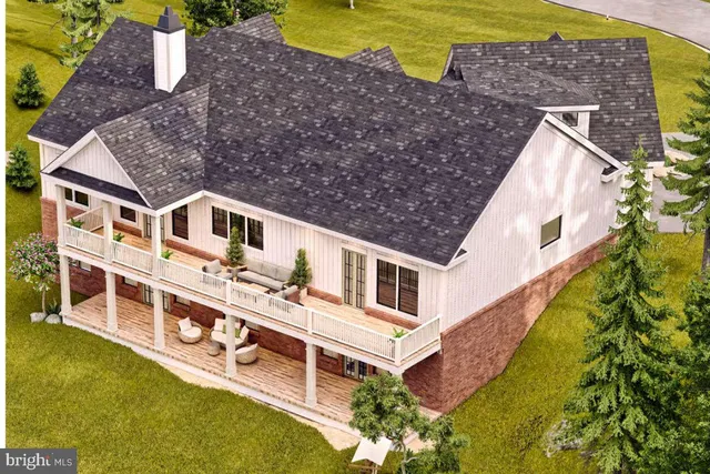 an aerial view of house with pool