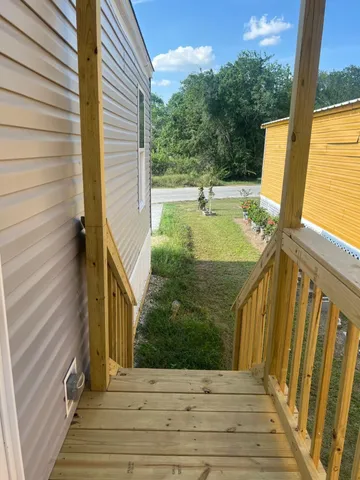 a view of balcony with furniture