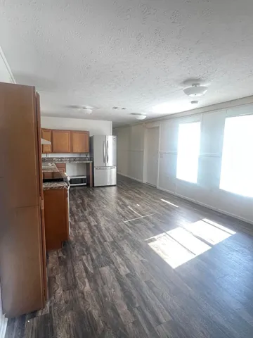 a view of a kitchen with a sink cabinets and a window