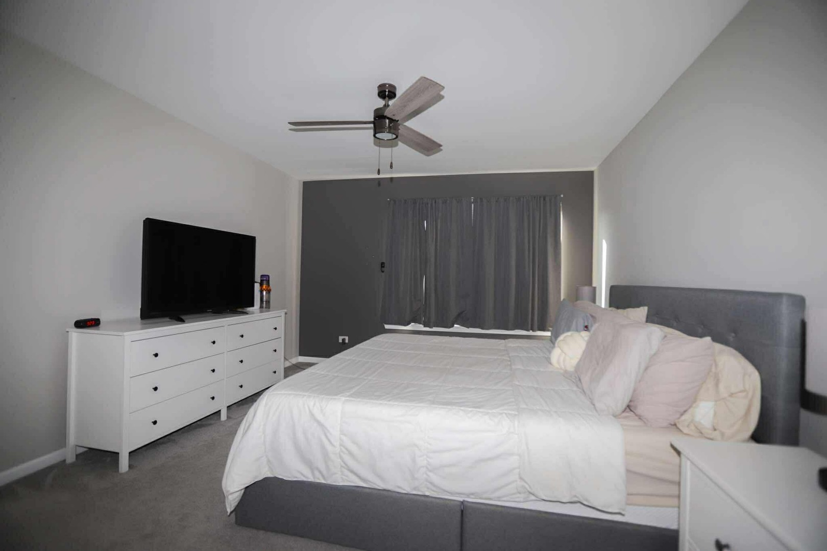 1117 Draper Road, Unit 1117 McHenry, IL 60050 - Photo 12 of 16 a bedroom with a bed and a flat screen tv