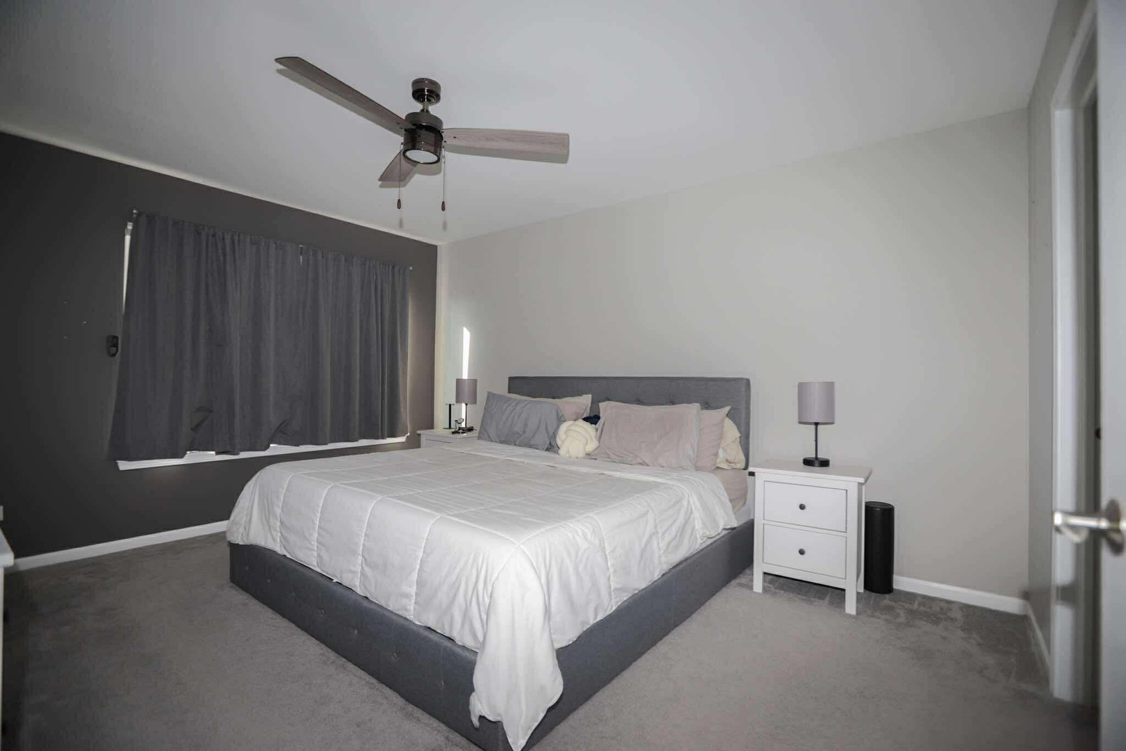 1117 Draper Road, Unit 1117 McHenry, IL 60050 - Photo 13 of 16 a bedroom with a bed and a ceiling fan