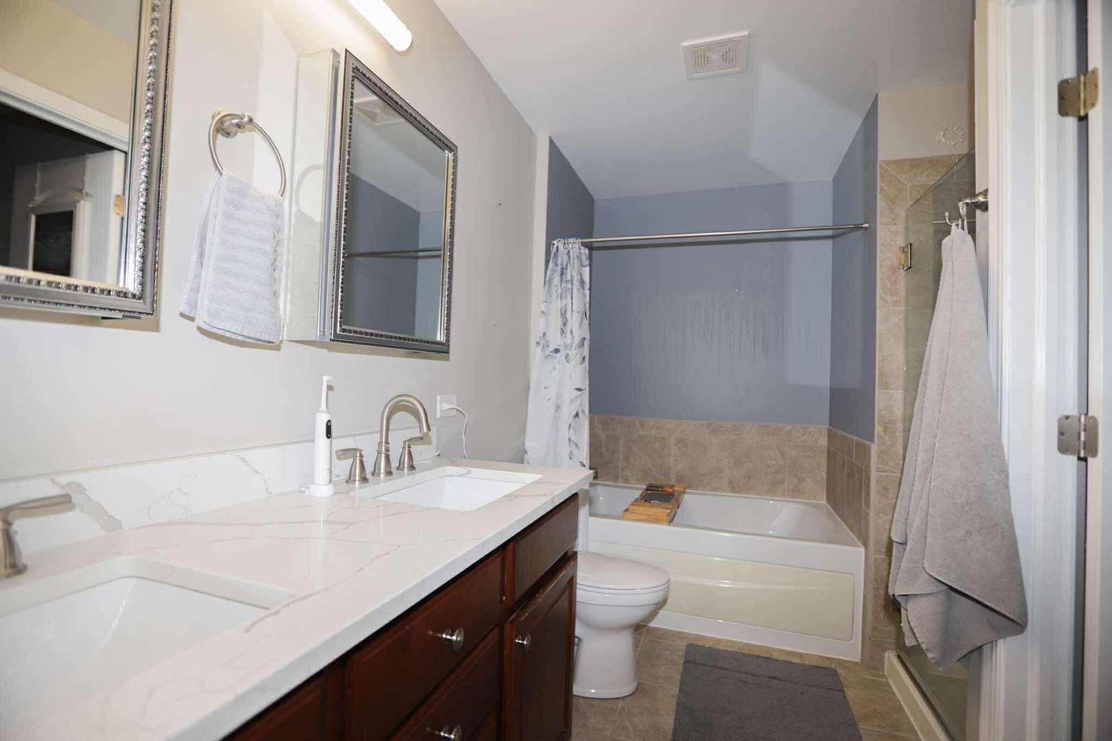 1117 Draper Road, Unit 1117 McHenry, IL 60050 - Photo 15 of 16 a bathroom with a sink a toilet and bathtub
