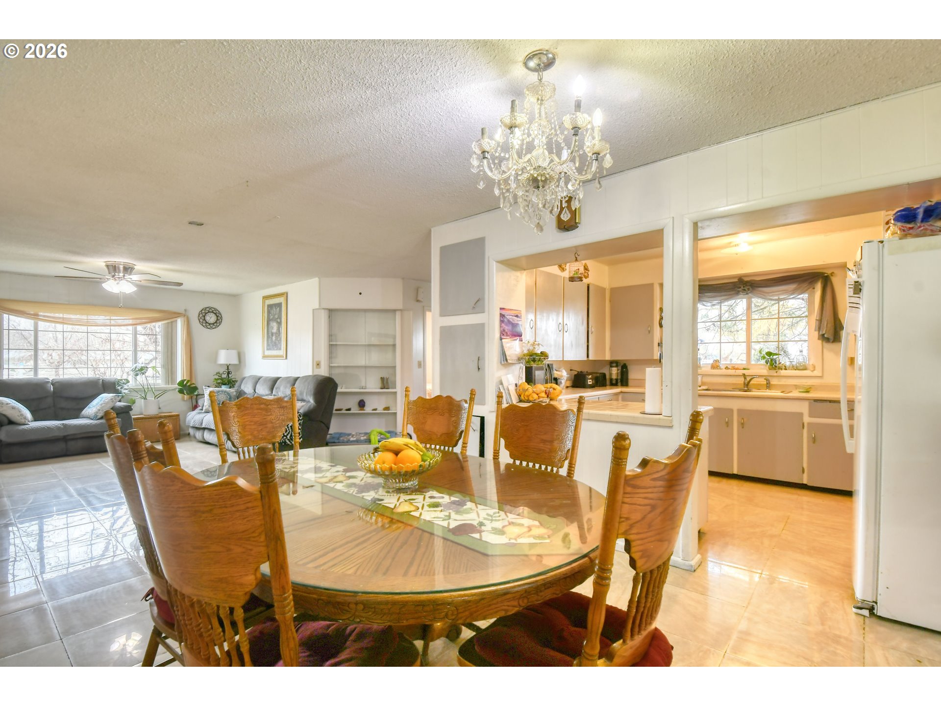 32611 Baxter Road Hermiston, OR 97838 - Photo 12 of 46 a dining room with furniture a chandelier and wooden floor