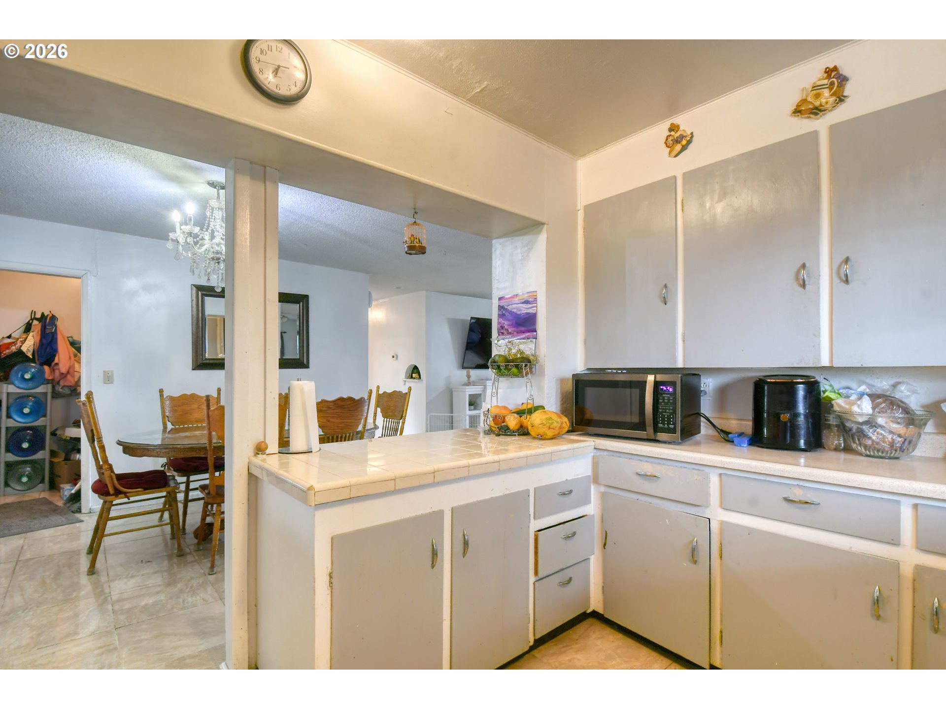 32611 Baxter Road Hermiston, OR 97838 - Photo 14 of 46 a kitchen with cabinets appliances and a view of living room