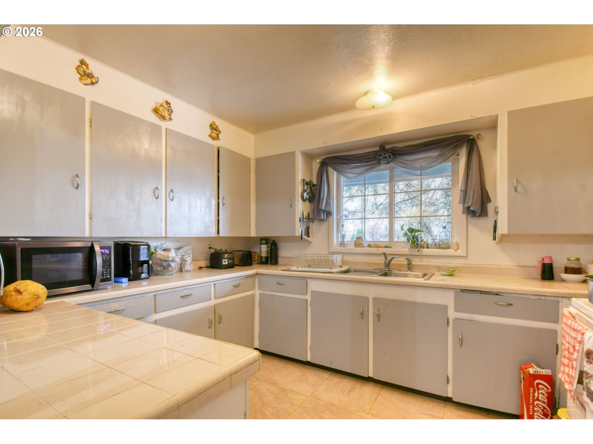 32611 Baxter Road Hermiston, OR 97838 - Photo 15 of 46 a kitchen with a sink and cabinets
