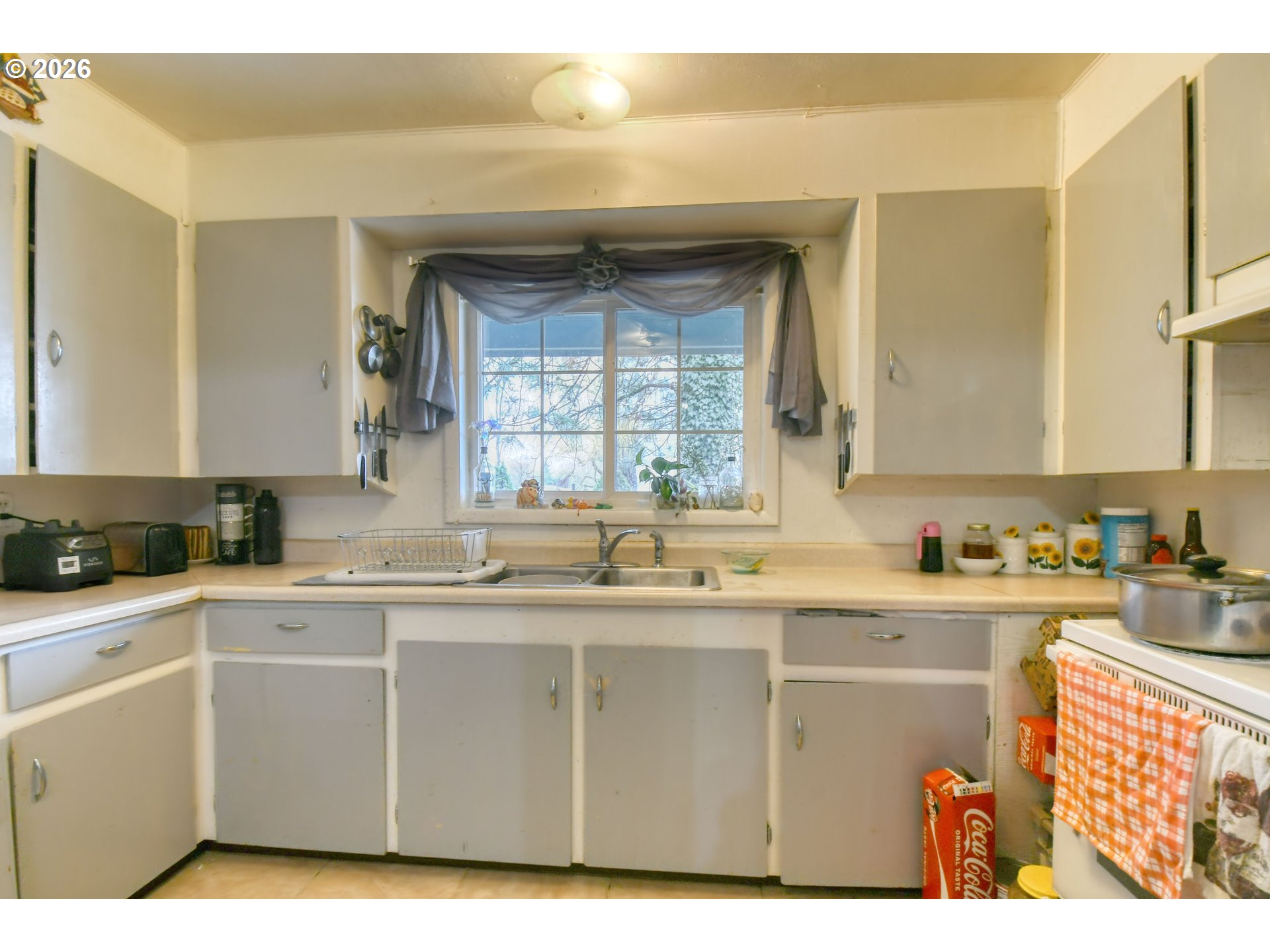 32611 Baxter Road Hermiston, OR 97838 - Photo 16 of 46 a kitchen with a sink and cabinets