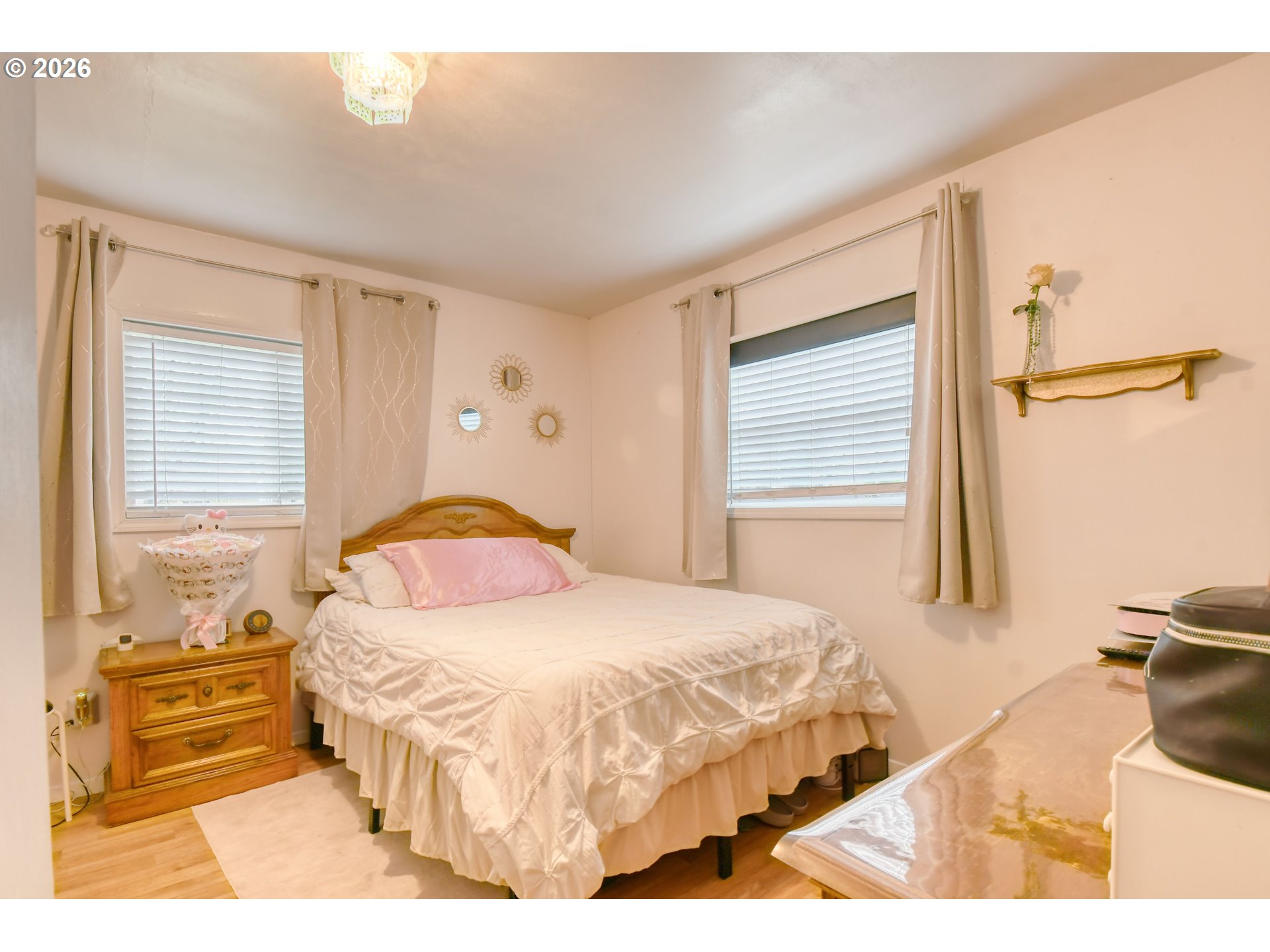 32611 Baxter Road Hermiston, OR 97838 - Photo 17 of 46 a bedroom with a bed and wooden floor