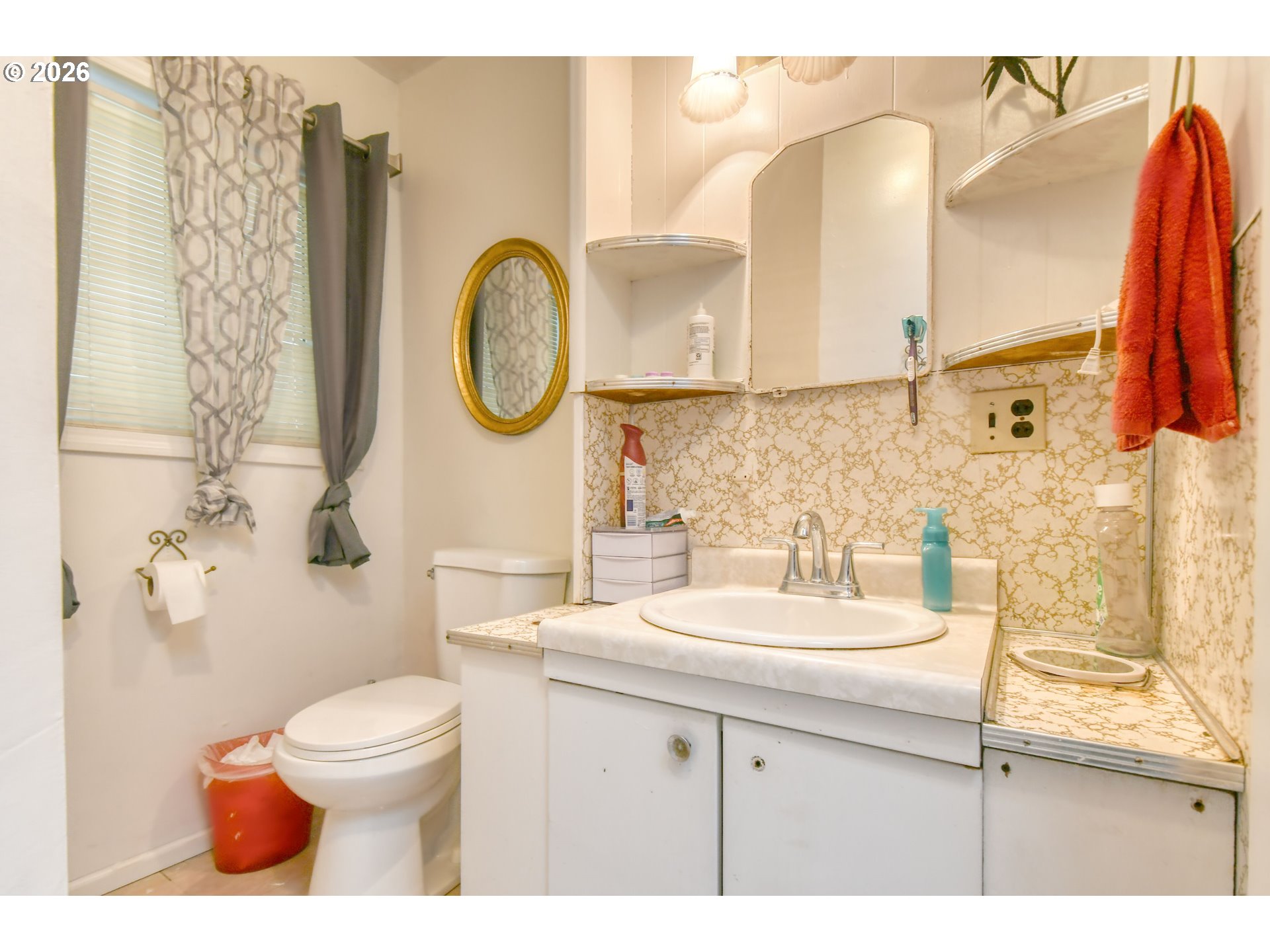 32611 Baxter Road Hermiston, OR 97838 - Photo 21 of 46 a bathroom with a sink mirror vanity and toilet