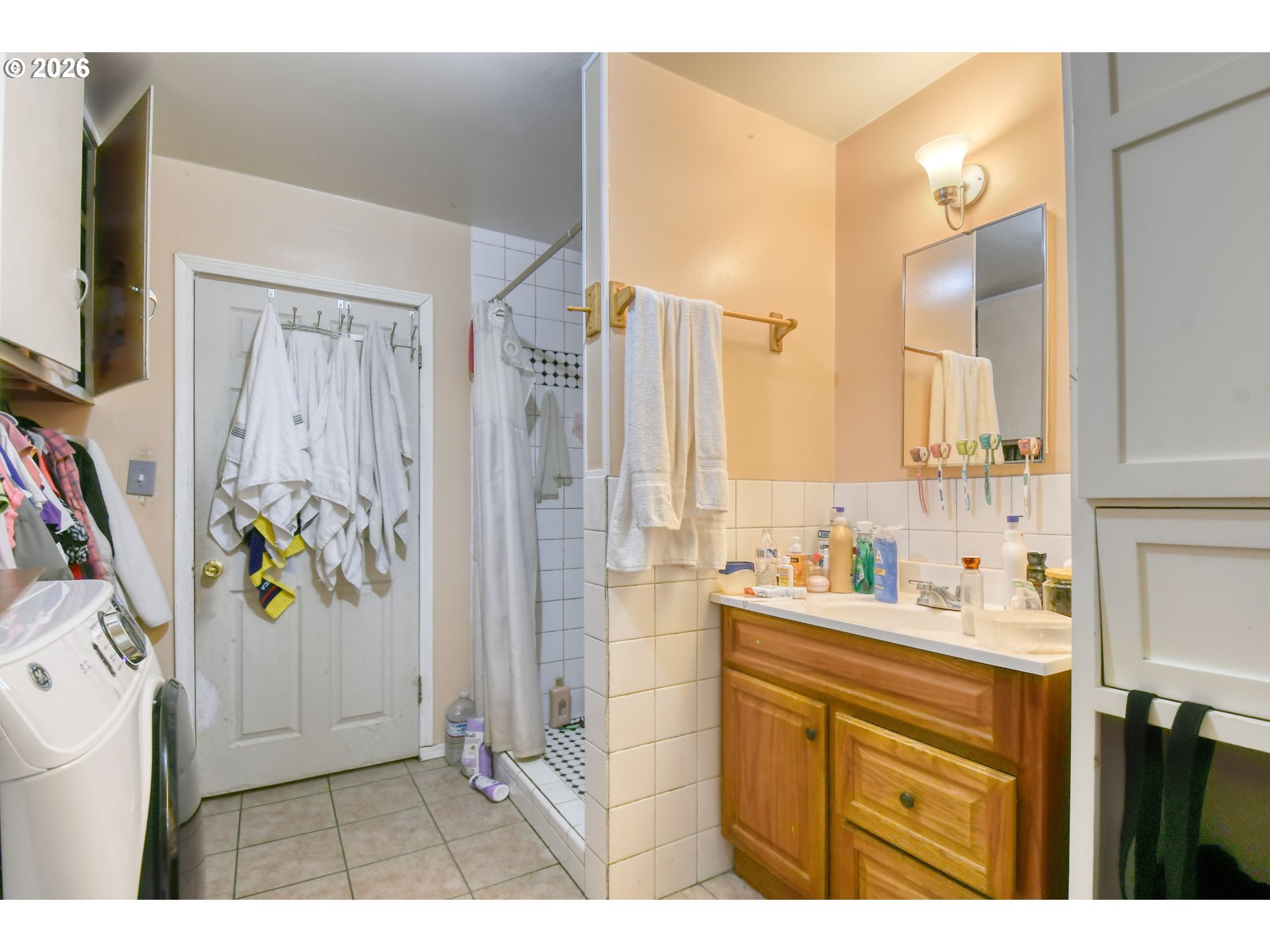 32611 Baxter Road Hermiston, OR 97838 - Photo 24 of 46 a bathroom with a sink a mirror a vanity and a shower