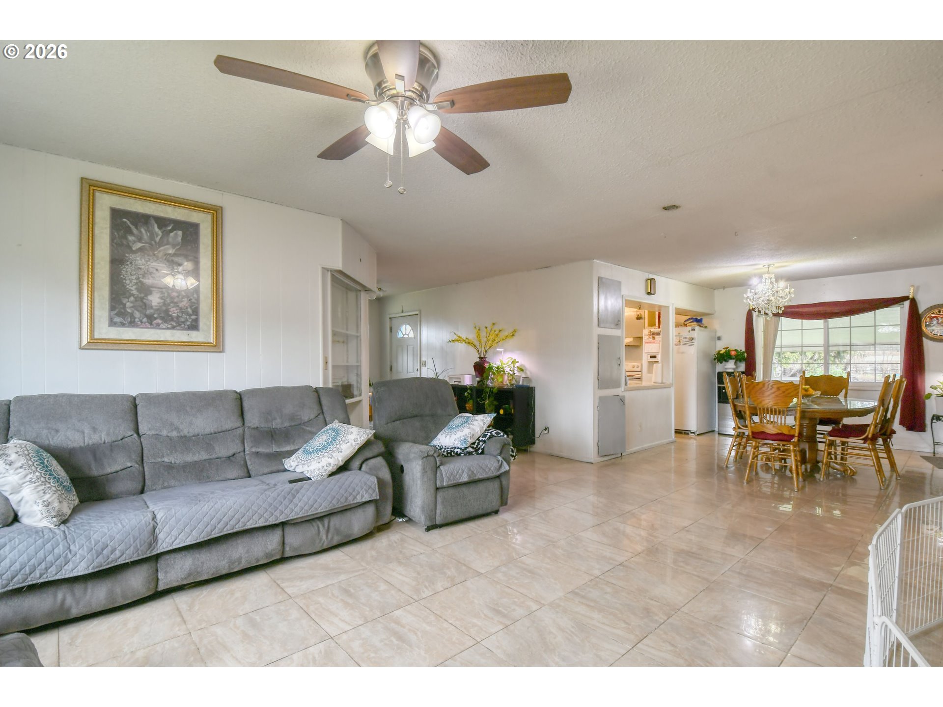 32611 Baxter Road Hermiston, OR 97838 - Photo 9 of 46 a living room with furniture and a dining room