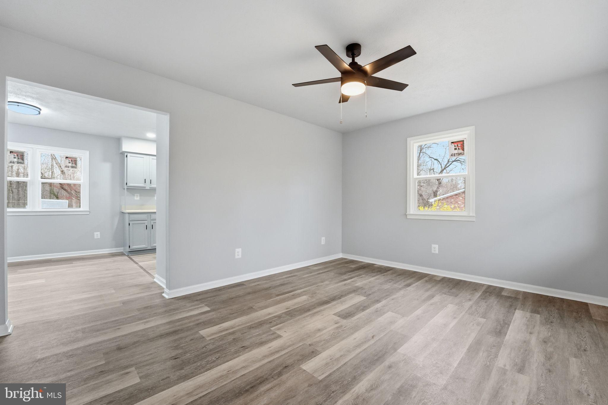 984 Oak Park Road Madison, VA 22727 - Photo 4 of 20 wooden floor in an empty room with a window