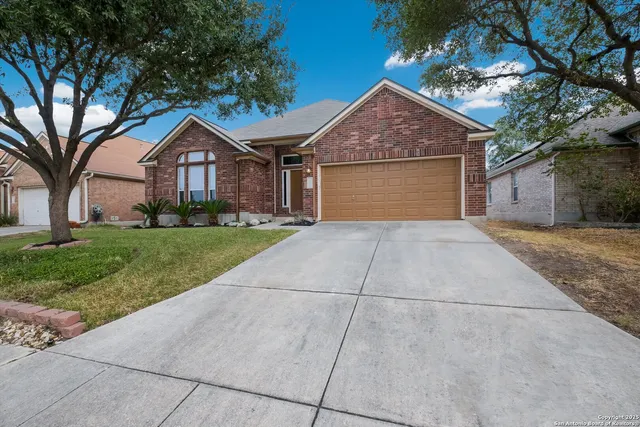 a front view of a house with yard