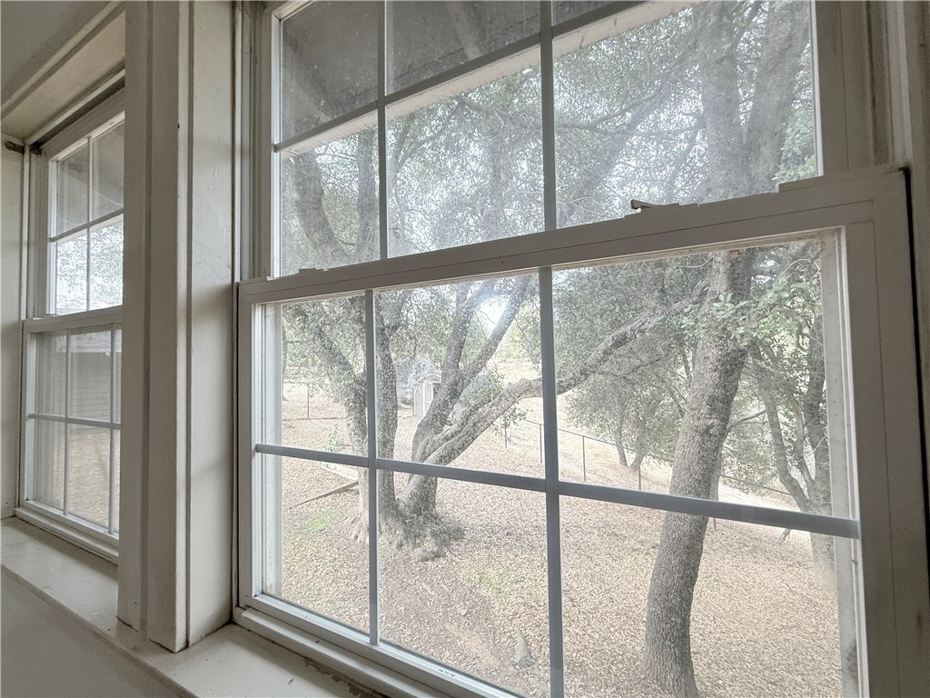 5264 Davis Road Midpines, CA 95345 - Photo 24 of 48 a view of an empty room with wooden floor and windows