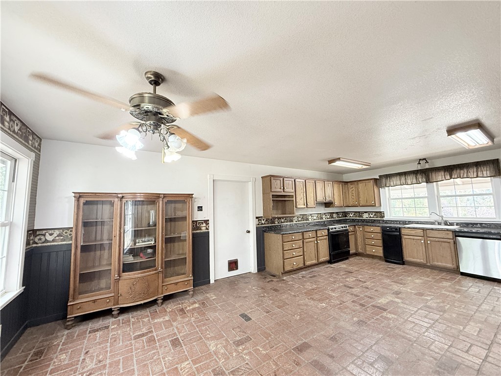 5264 Davis Road Midpines, CA 95345 - Photo 26 of 48 a large kitchen with cabinets and stainless steel appliances