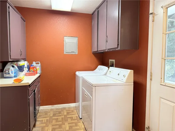 a bathroom with a toilet a sink and a window
