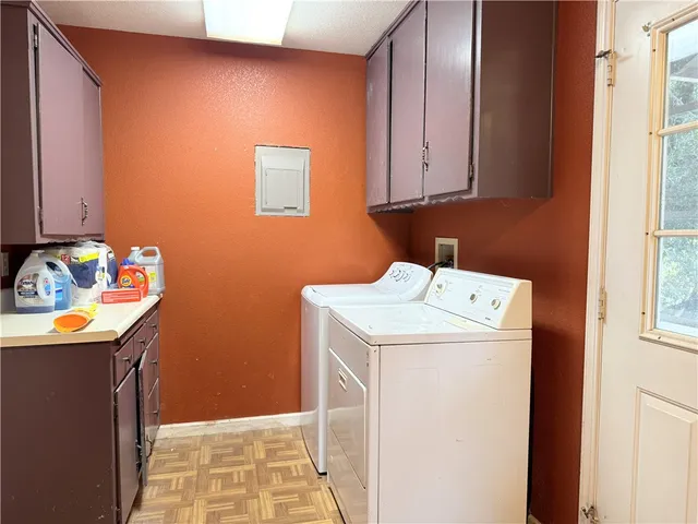 a bathroom with a toilet a sink and a window