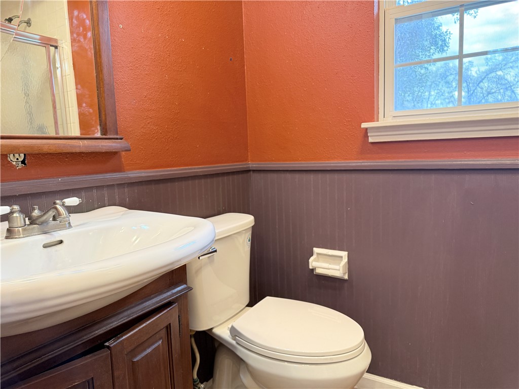 5264 Davis Road Midpines, CA 95345 - Photo 28 of 48 a bathroom with a sink a toilet and a mirror