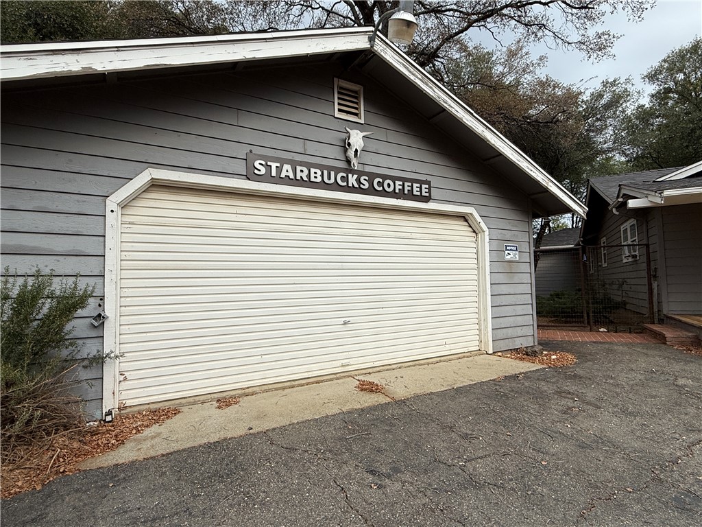 5264 Davis Road Midpines, CA 95345 - Photo 10 of 48 a view of a house with a garage